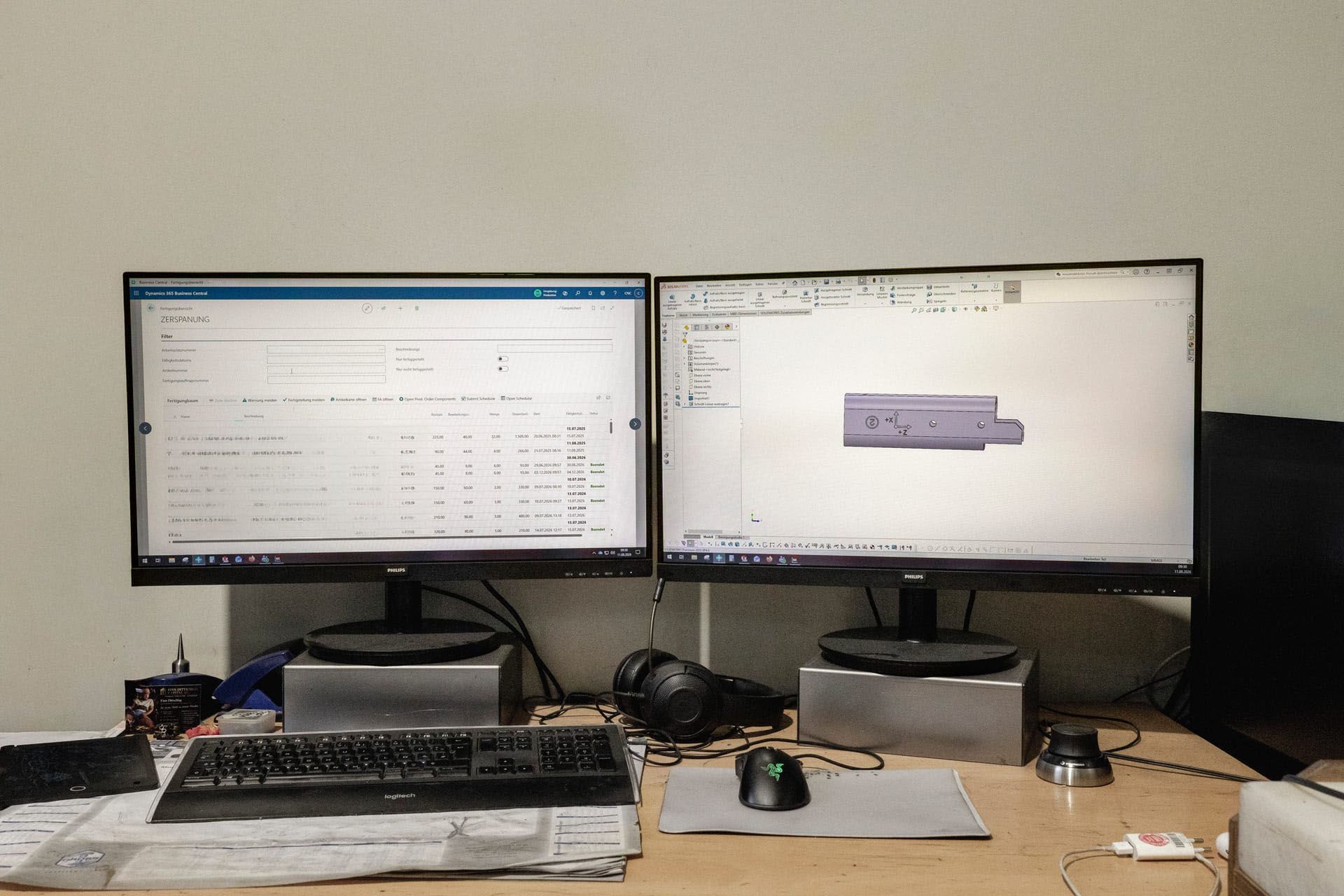 Business Central and a CAD model on two monitors at the workstation