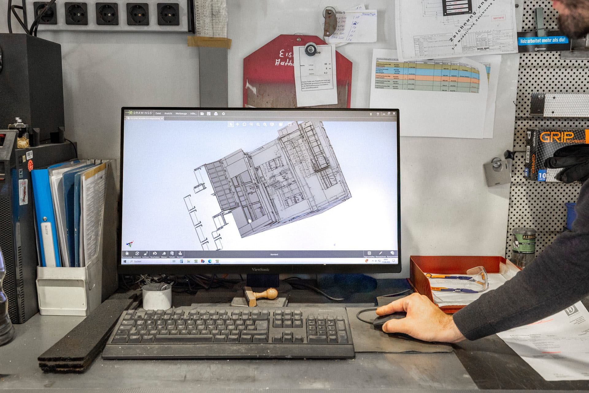 3D CAD model of an assembly at a workstation on the shop floor