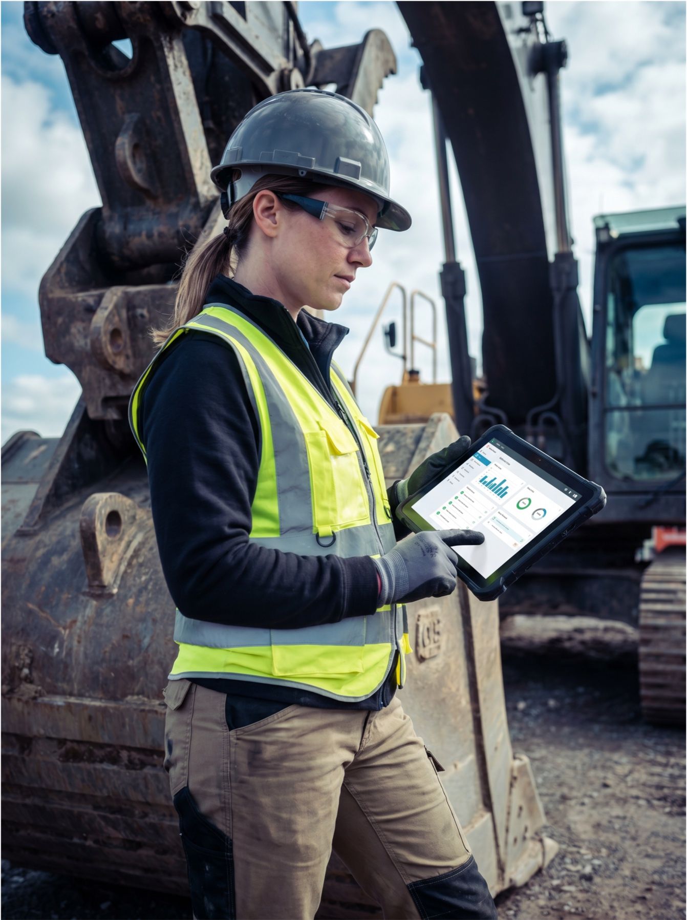 Field-service technician at an excavator using the mobile service app