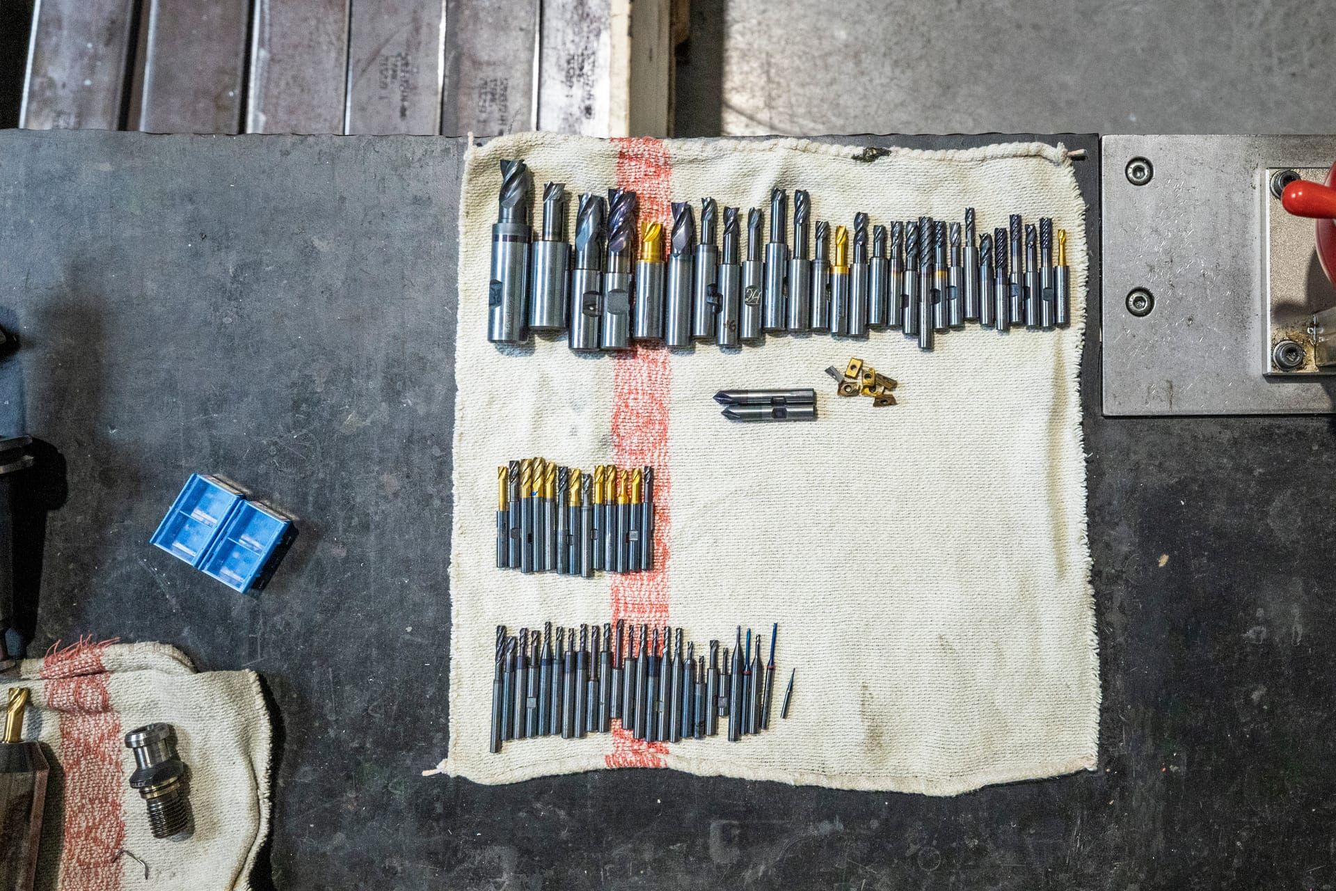 Milling tools laid out and prepared for machining